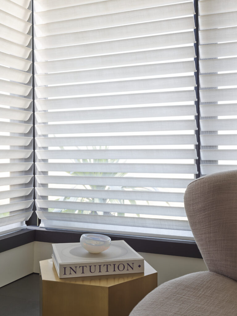 Sheer shades with softly tilted vanes in an elegant Calgary living room
