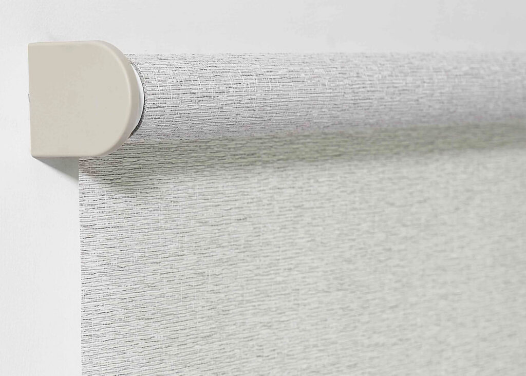 Detailed view of roller shades in a refined Calgary living room